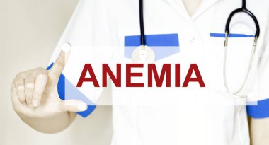 Doktor elinde ANEMIA yazılı bir kart tutuyor, tıbbi konsept.