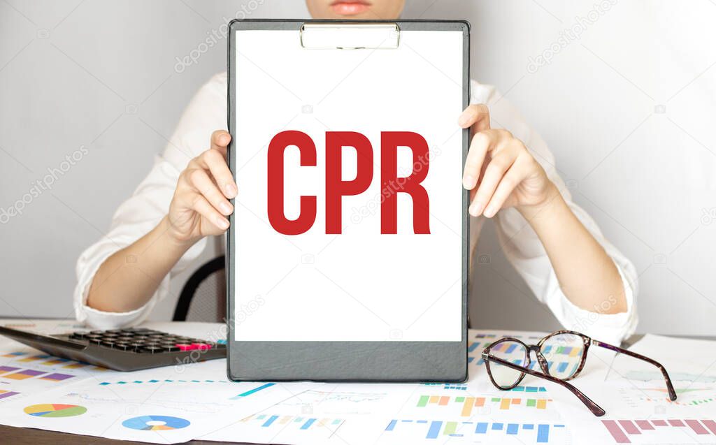 businesswoman holding a card with text CPR
