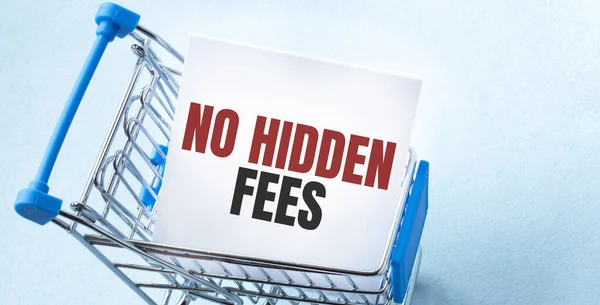 Shopping cart and text NO HIDDEN FEES on white paper note list. Shopping list concept on blue background.