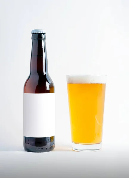 Beer Bottle Mock-Up with glass of session pale ale and foam. Blank Label on white background
