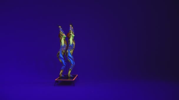 Acrobatic Twins Neon Costumesto Perform Stand Hands Head Blue Cyclorama — Stock Video