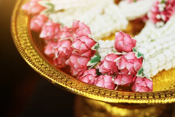 Flower garlands on a gold tray in tradition Thai wedding ceremony day. Jasmine garland.