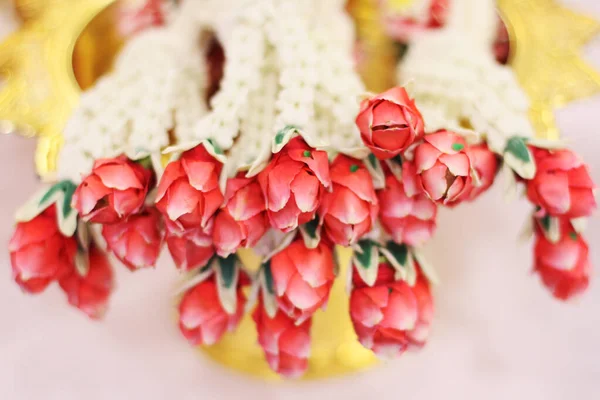 Flower garlands on a gold tray in tradition Thai wedding ceremony day. Jasmine garland