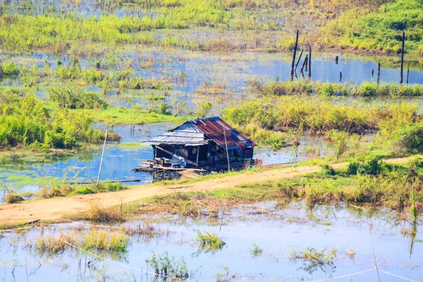 Houseboat in the Songgaria river and near mountain in Countryside of village at Snagklaburi, Thailand