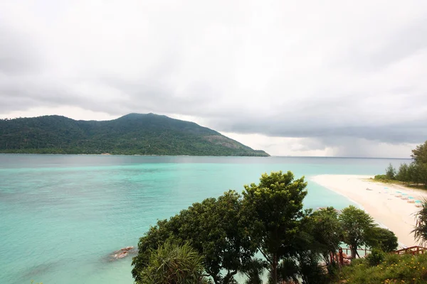 Beautiful paradise in summer of seascape and sea horizon with Calm ocean and cloud sky on rock mountain Cape.Tropical Beach plants and jungle island