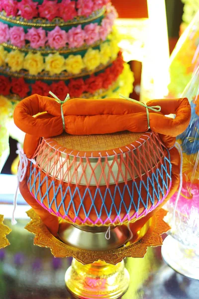 Yellow robe on Monk\'s alms bowl for Newly ordained Buddhist monk pray with priest procession.