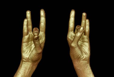 Siyah arka planda iki altın el. Kristalin Hint sembolü Yaşam ve meditasyon ve arındırma.