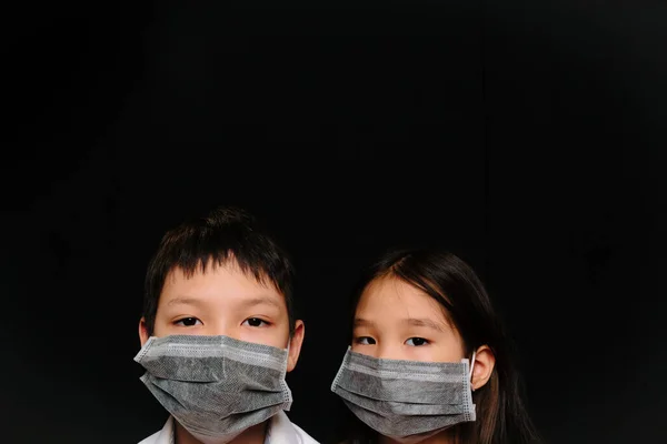 Portrait Two Asian Kids Medical Masks Black Background — Stock Photo, Image