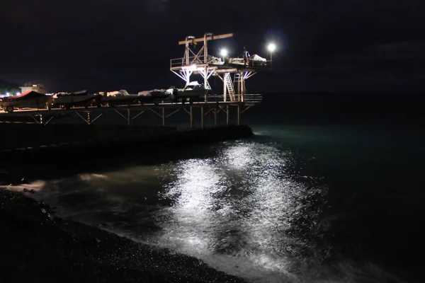 Boat pier on the Black Sea at night. Massandra, Crimea, Ukraine