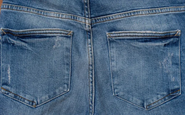 Blue Jeans Terug Zak Houten Achtergrond — Stockfoto