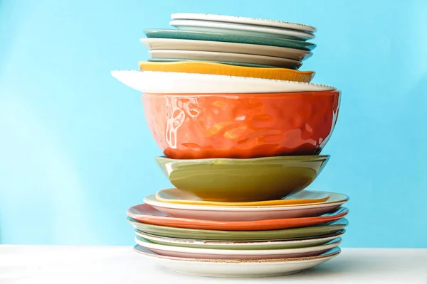 Colorful Tableware Stack on Blue Color Background — Stock Photo, Image