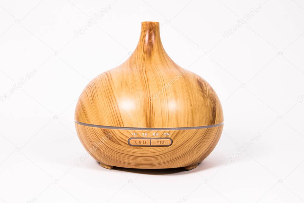 humidifier in the form of a wooden aroma lamp on a white background