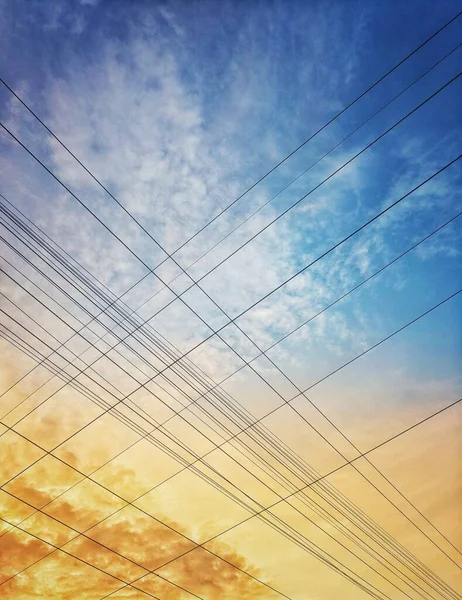 electrical lines crossing in sky