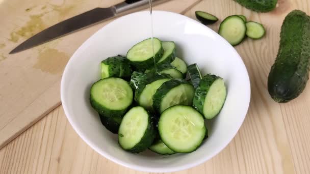 Sliced Cucumbers White Bowl Pour Oil Fresh Organic Green Vegetables — Stock Video