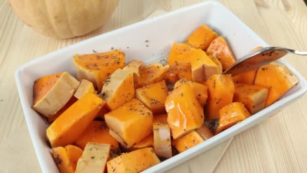 Sliced Pumpkin Oil Dried Spices Stirred Spoon Cooking Orange Baked — Stock Video