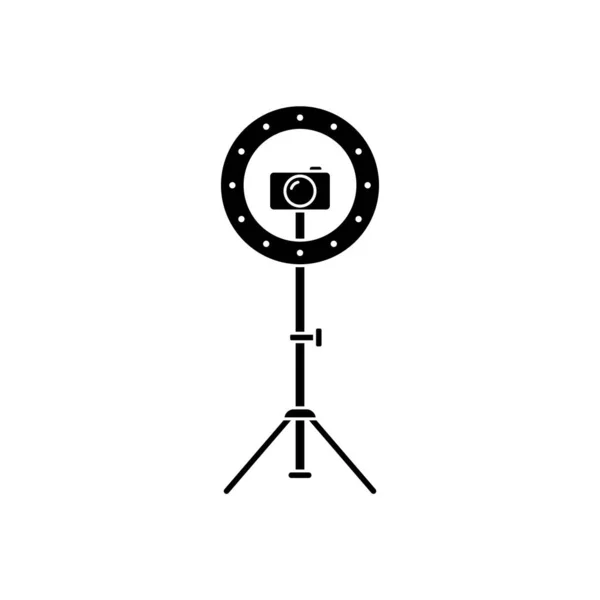 Cutout silhouette Led ring lamp on tripod with camera. Outline icon. Black simple illustration of light for selfie, blogger. Flat isolated vector image on white background