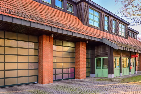 Building of a volunteer fire department in Berlin, Germany. You will see the entrance to the fire station with some gates for the fire engines.