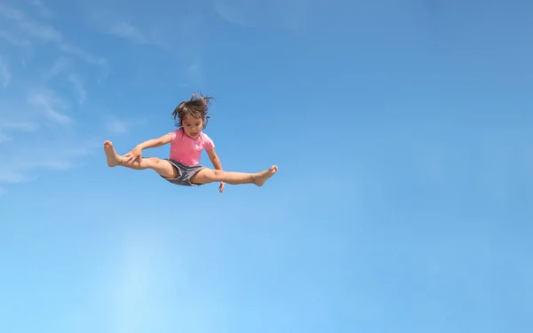 Little Girl Jumping Isolated Blue Sky — Stock Photo, Image