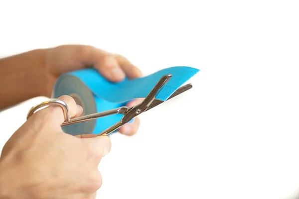 Woman Cutting Physio Tape Rolling White Background — Stock Photo, Image