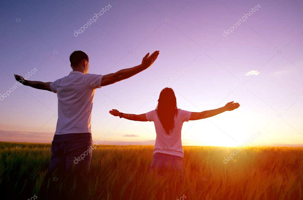Couple feeling free in a beautiful natural setting.