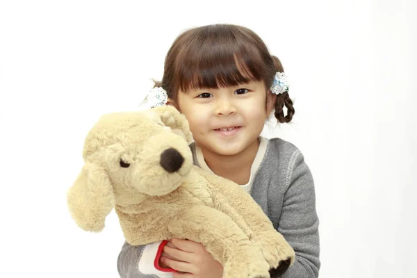Japon kız (beyaz geri tutan bir oyuncak köpek (4 yaşında)) — Stok fotoğraf