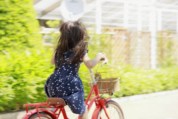 Japanese girl riding on the bicycle (4 years old) — Stock Photo, Image
