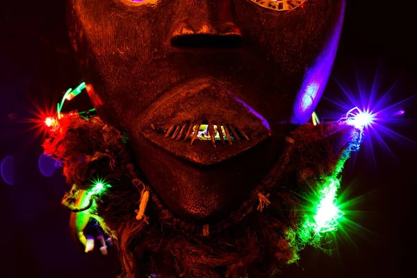 Close Isolated Colorful Illuminated Spooky African Wood Mask Black Background — Stock Photo, Image