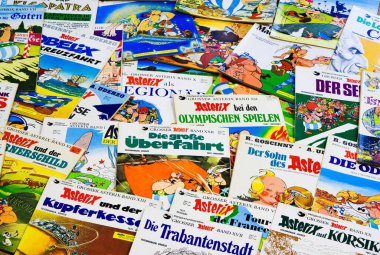 VIERSEN, GERMANY - JULY 29. 2019: Close up of countless issues of german Asterix and Obelix comics clipart