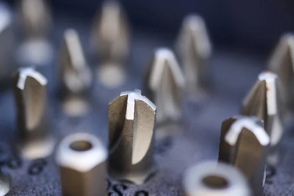 Makro close up of tool box with set of different types screw drive heads bits (Focus on Quadrex socket head)