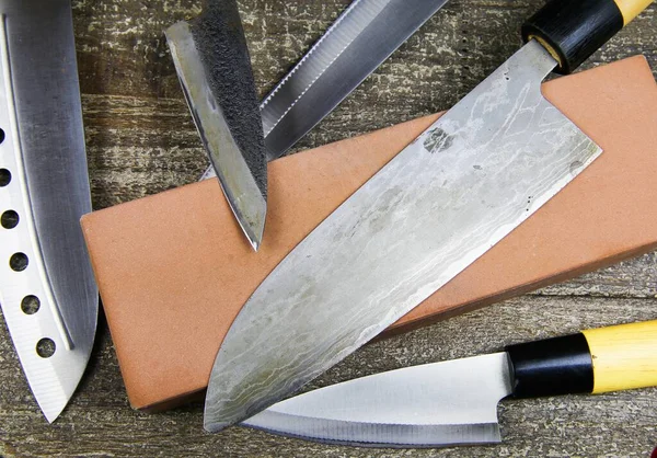 Grinding Knifes Close Different Metal Japanese Kitchen Knifes Sharpening Stone — Stock Photo, Image
