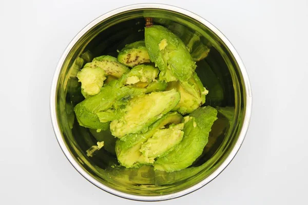 Close Isolated Metal Bowl Cut Avocado Flesh Slices White Background — Stock Photo, Image