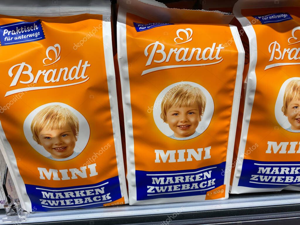 Viersen, Germany - July 9. 2020: Closeup of bags in a row with Brandt rusk crisp breads in german supermarket (focus on center)