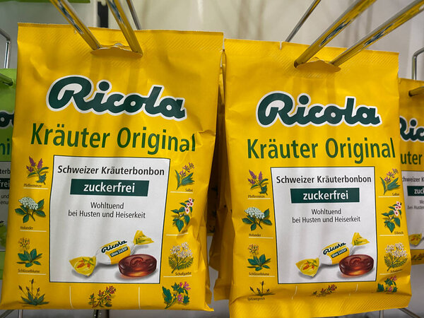 Viersen, Germany - July 9. 2020: View on swiss Ricola herb candies packets in german supermarket (focus on center)