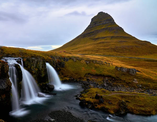 Kirkjufell (Church Mountain) mountain in Autumn colours in Snaefellsnes peninsula, Iceland on overcast early October afternoon in 2019.
