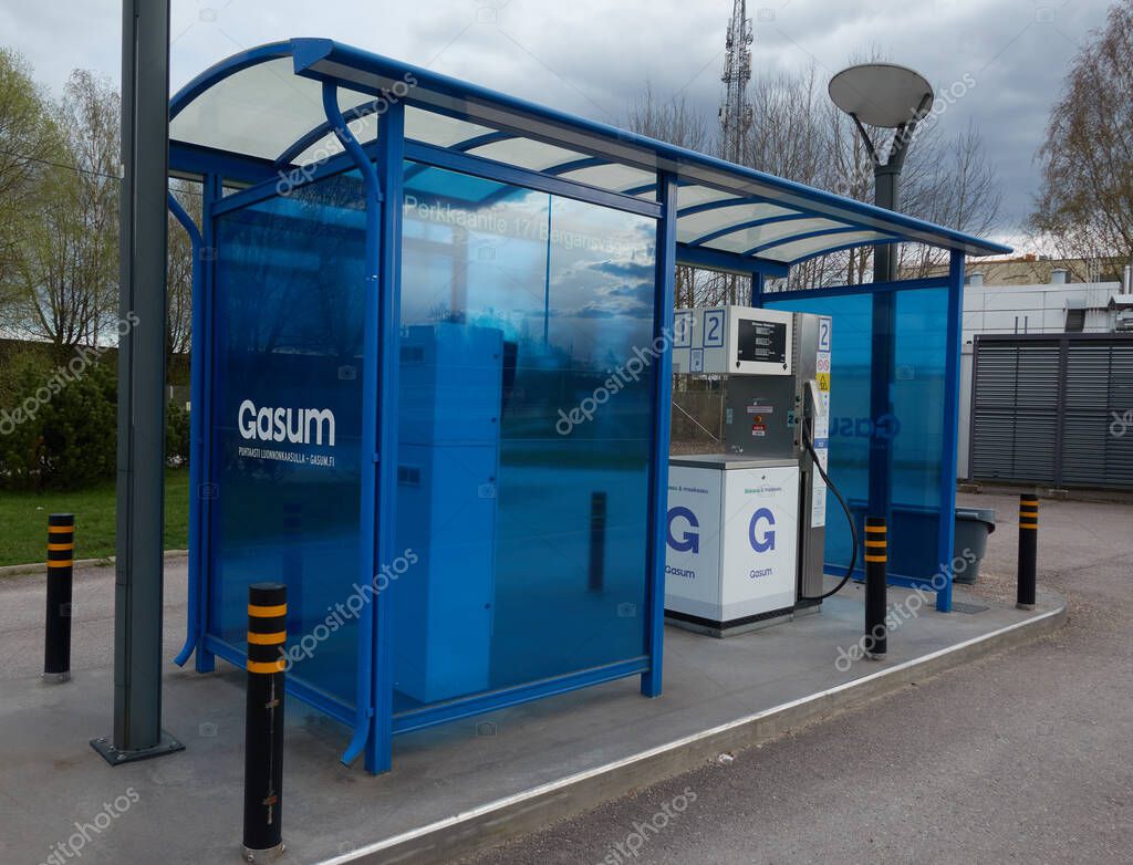 Espoo, Finland - May 6, 2020: Gasum gas company unmanned compressed natural gas (CNG) dispenser for cars that are able to utilize liquified natural gas (LNG) or biogas in their engines on cloudy day in May.