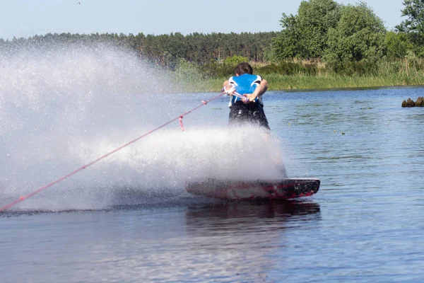 Cherkassy. Ukraine. May 27, 2018. A man is riding a wakeboarding on river Dnepr. — Stock Photo, Image