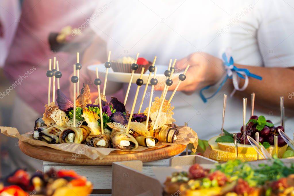 Outdoor Cuisine Culinary Buffet Dinner Catering. Group of people in all you can eat. Dining Food Celebration Party Concept. Service at business meeting, weddings.
