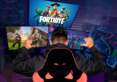 Ukraine, Cherkassy - January 13, 2019: Teenager gamer playing Fortnite video game, Fortnite is a web based multi player survival game developed by Epic Games. cybersport clipart