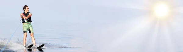 closeup man riding water skis on lake in summer at sunny day. Water active sport. Space for text. Panoramic view
