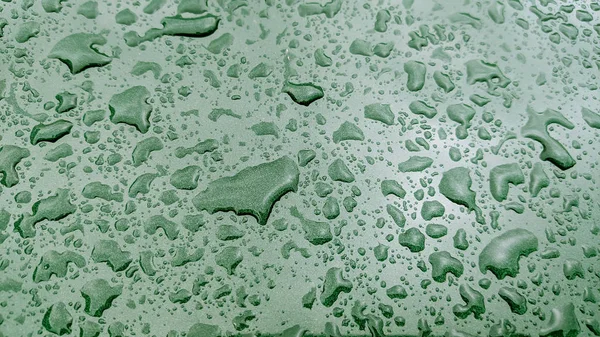 민트 색의 휴일 화려 한 배경. 여러분의 디자인을 위한 흐릿 한 녹색 배경. 명절 컨셉트, 새해 축하. 자정 연두색. 물방울 방울 — 스톡 사진