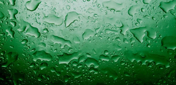 민트 색의 휴일 화려 한 배경. 여러분의 디자인을 위한 흐릿 한 녹색 배경. 명절 컨셉트, 새해 축하. 자정 연두색. 물방울 방울 — 스톡 사진