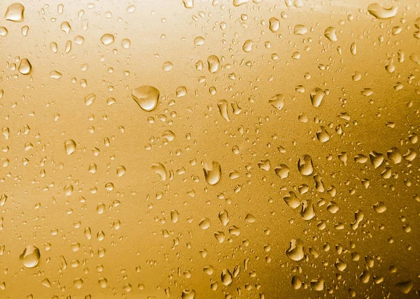 Gold drops abstract background, metallic color