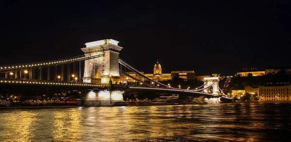 Long exposure of Chain Bridge, Buda Castle and the Danube River at night in summer, Budapest, Hungary