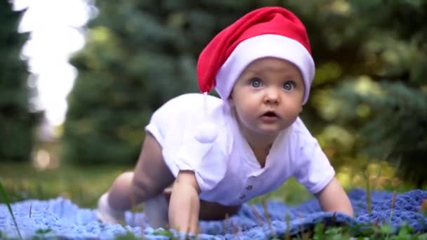 Little Blue Eyed Baby Santa Claus Hat — Stock Video