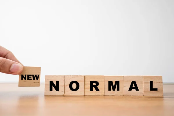 Hand Putting Wooden Block Cubes New Normal Wording World Changing — Stock Photo, Image