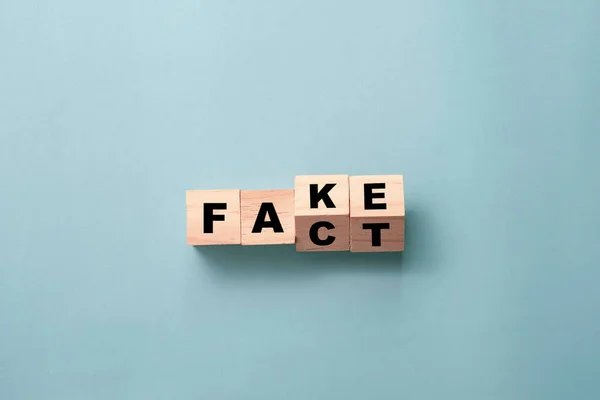 Flipping Wooden Cubes Block Change Wording Fake Fact — Stock Photo, Image