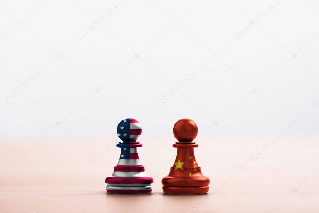 USA flag and China flag print screen on pawn chess with light soft background.It is symbol of tariff trade war tax barrier between United States of America and China.-Image.