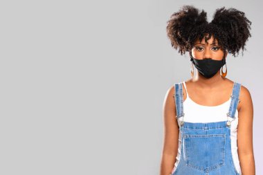 Brazilian teenager wearing face mask incorrectly clipart