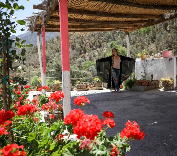 A girl in an arabic cape in nature. Paradise Valley Agadir Morocco.