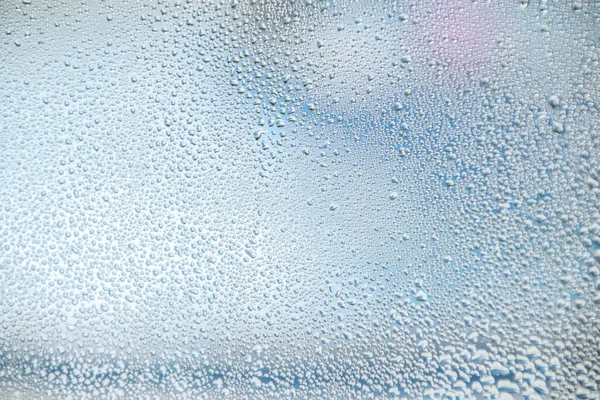 water droplets on glass window see to outside